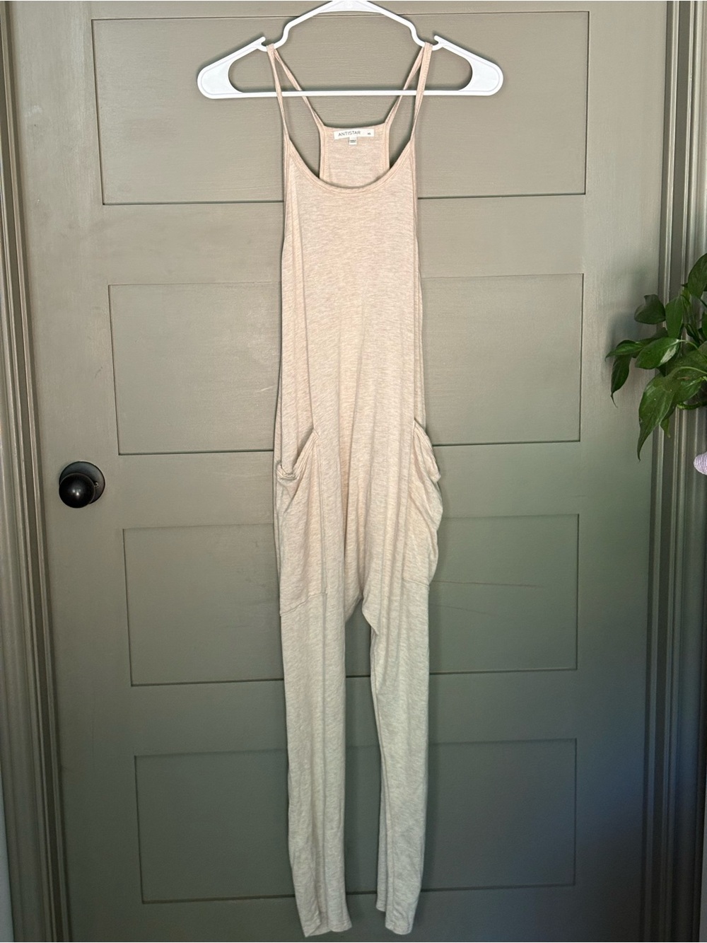 Sleeveless Neutral Jumpsuit with Side Draped Pockets